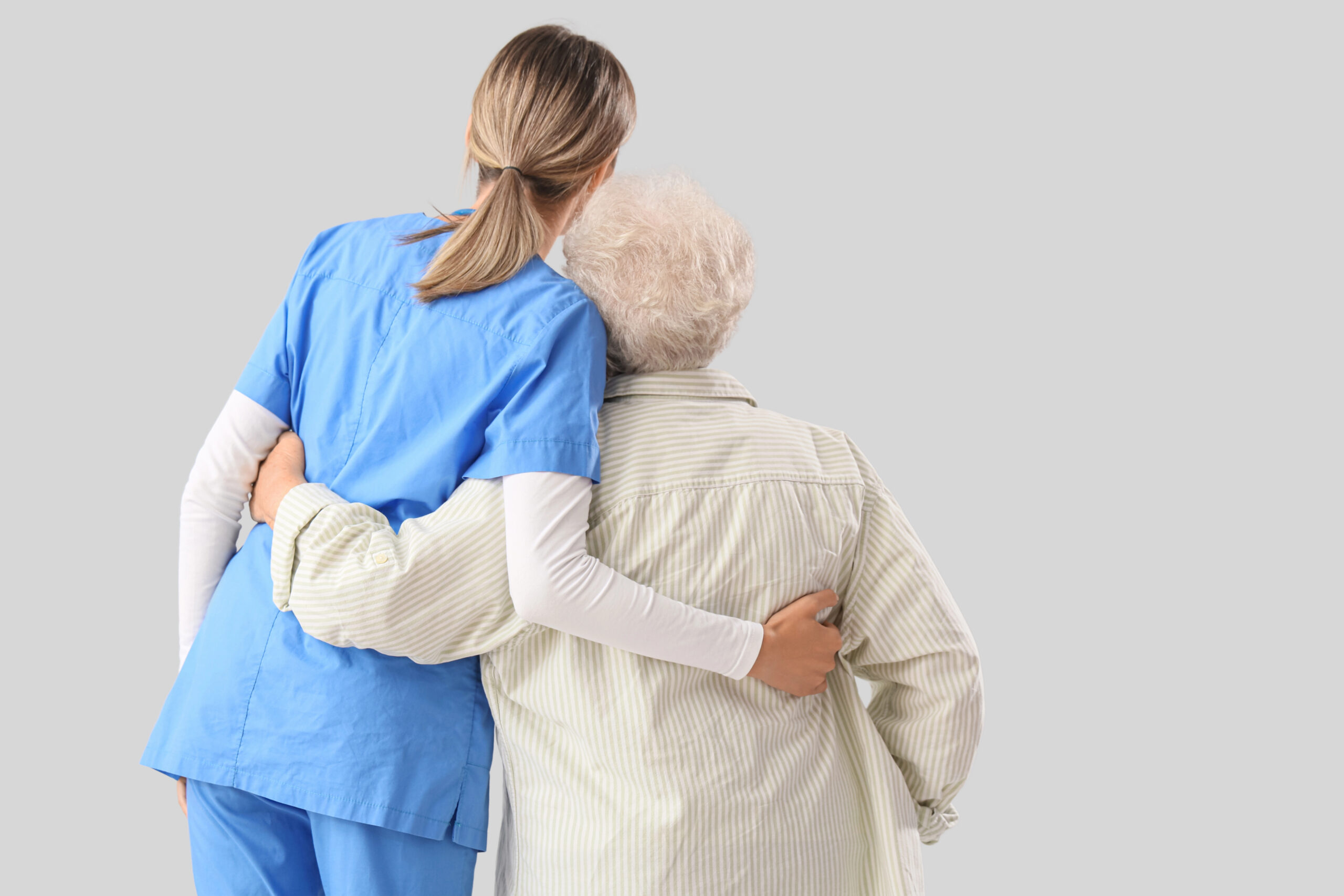 Doctor assisting elderly patient - AI use in hospitals must support, not replace, humans