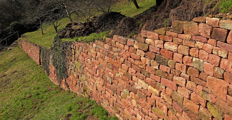 Retaining wall that has been integrated into a hillside