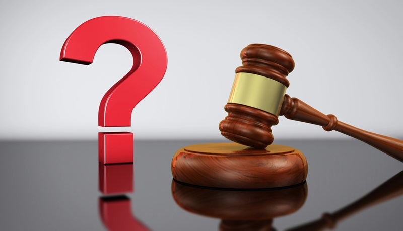 Image of a gavel next to a question mark